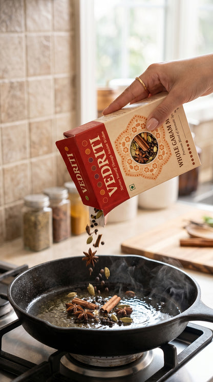 Traditional Whole Garam Masala Being Tempered in a Cast-Iron Skillet