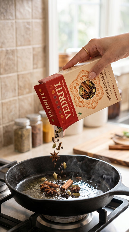 Traditional Whole Garam Masala Being Tempered in a Cast-Iron Skillet